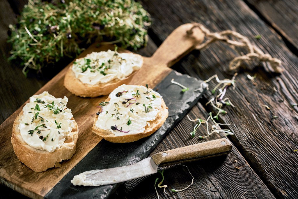 Homemade cream cheese with crunchy baguette